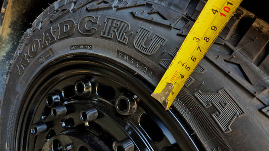 Tape measure measuring the sidewall of a Roadcruza branded tyre 