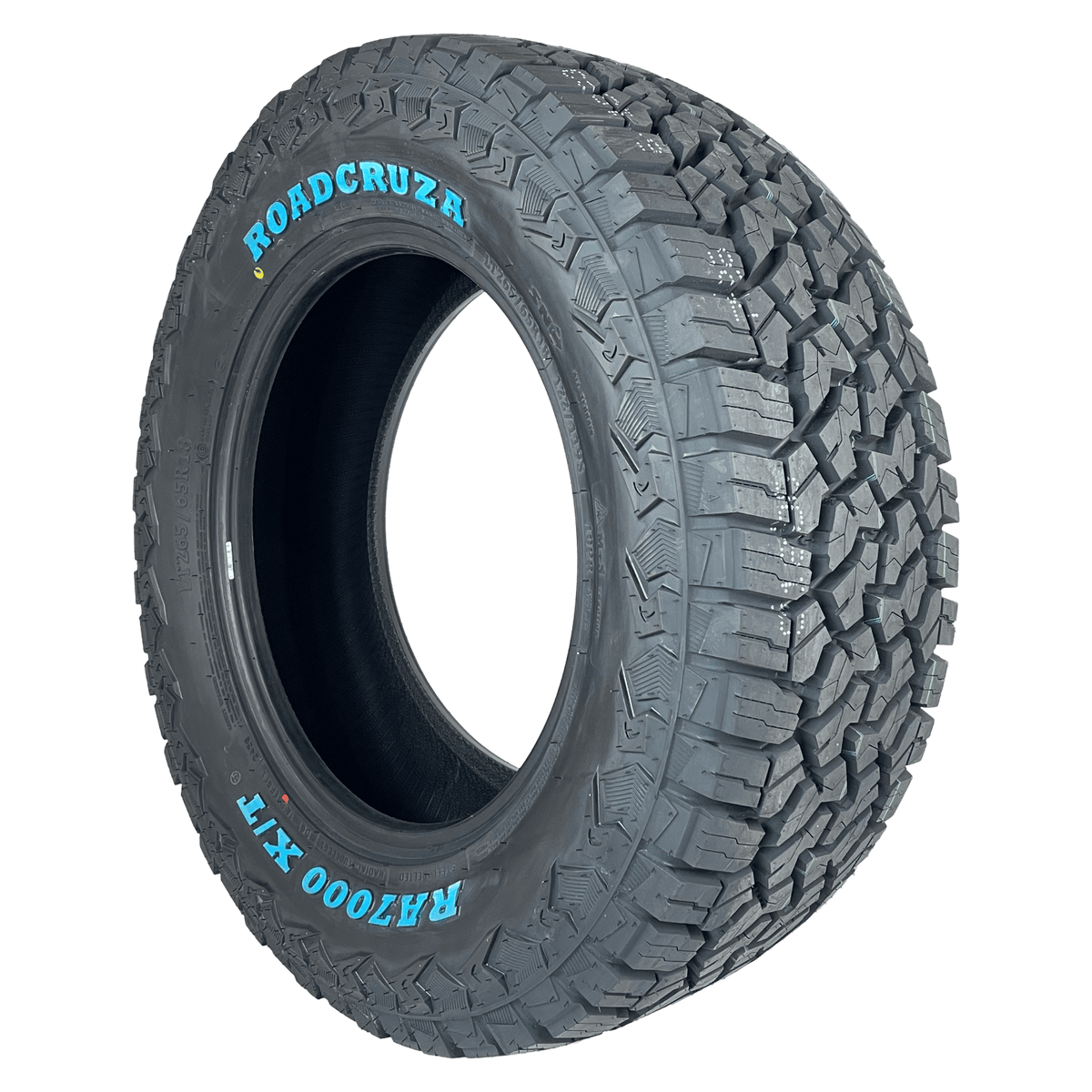A single off-road tire shown at a three-quarter angle on a plain white background. The sidewall features the brand name 'ROADCRUZA' in blue lettering and the model 'RA7000 X/T' in white lettering.