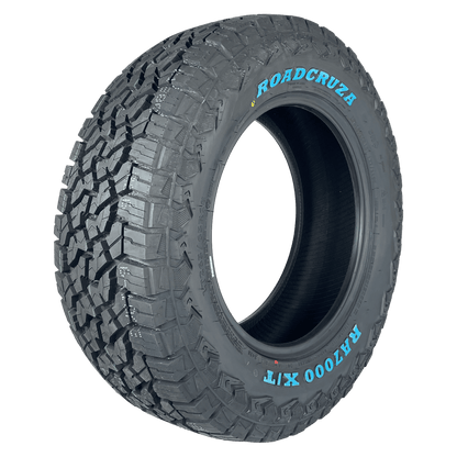 A single off-road tyre shown at a three-quarter angle on a solid white background, featuring the brand name ROADCRUZa and model name RA700 X/T white lettering on the sidewall.